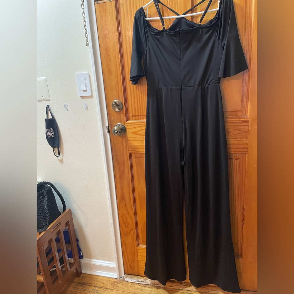 Venus black pants off the shoulder romper. Size small. 2 pockets. Never worn.